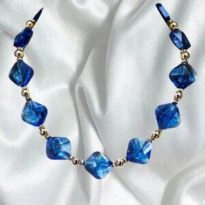 Blue glass necklace with silver beads made with light blue square glass beads
